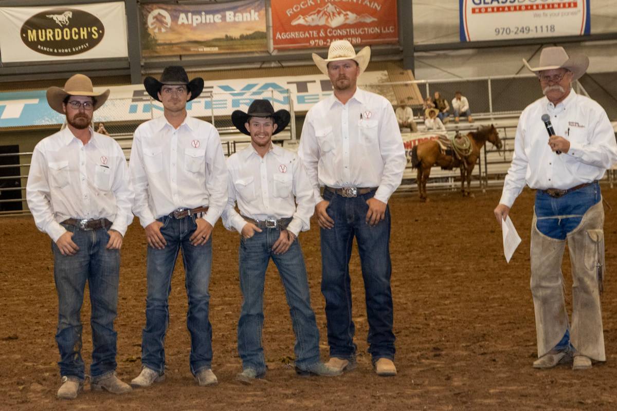 Cowboys and Announcer at Indoor Rodeo Arena