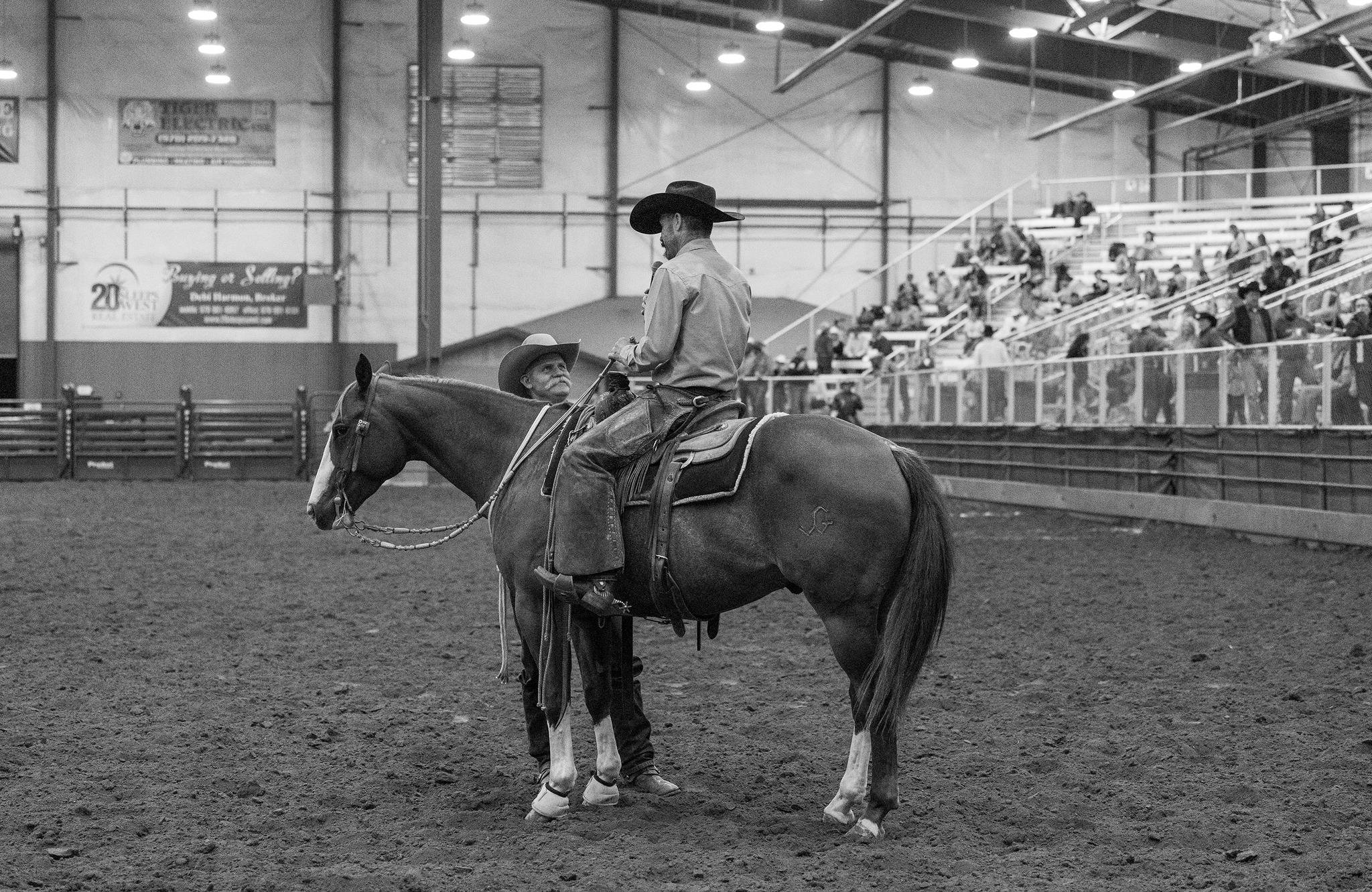 Cowboys and Horse in Indoor Rodeo Arena