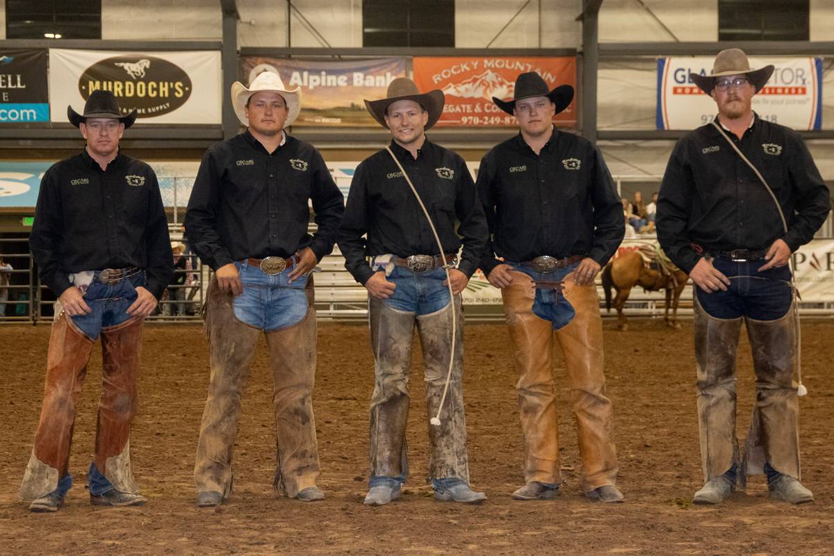 Five Cowboys Posing in an Indoor Rodeo Arena